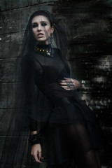 Fashiom model dressed in gothic style. Vamp.