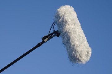 Microphone with windshield with blue sky background