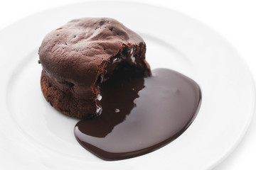 Chocolate fondant on white plate, closeup