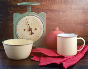 Vintage kitchen scales and tin cups and pans