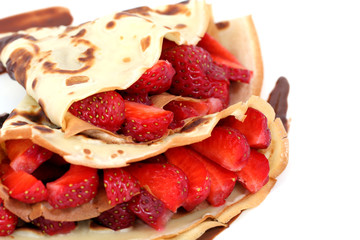 close-up dessert: isolated pancakes with strawberry and chocolate