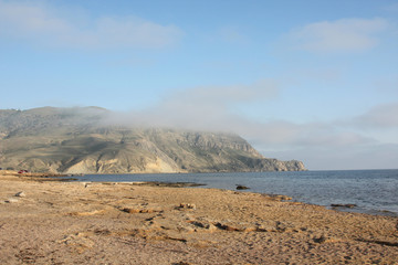 beautiful seaside view - sand, mountain and sea
