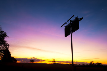 Rusted fuel station silhouette sign in the outbacks of Brisbane, Queensland.