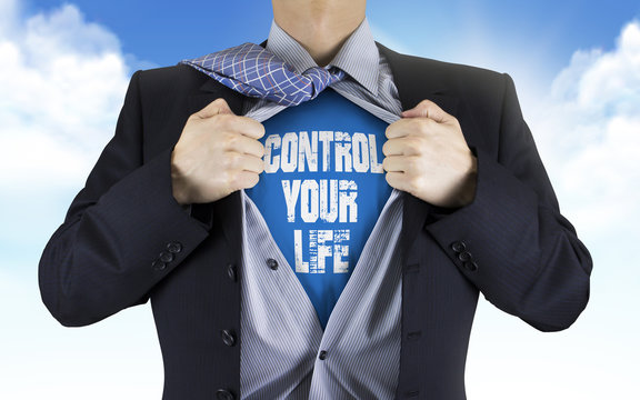 businessman showing Control your life words underneath his shirt