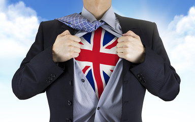 businessman showing United Kingdom flag underneath his shirt
