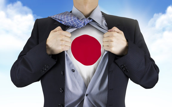 businessman showing Japan flag underneath his shirt