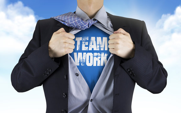 businessman showing Teamwork word underneath his shirt
