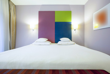 Interior of a colorful hotel bedroom