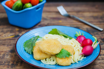 spaghetti and chicken cutlets with vegetables