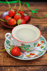 coffee in a cup and strawberry