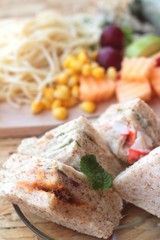 Club sandwich and pasta spaghetti with salad mix fruit