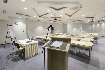Speaker's stand and microphone in modern classroom