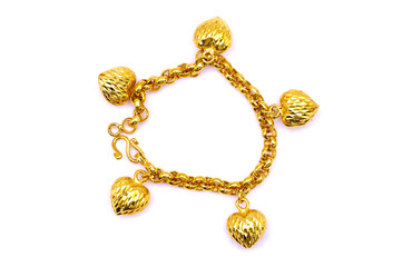 Gold bracelet over white background