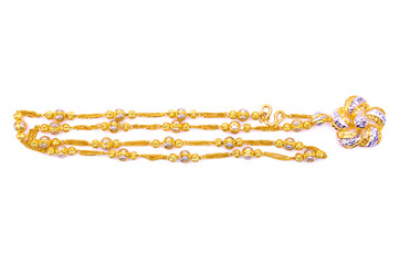 Gold necklace over white background
