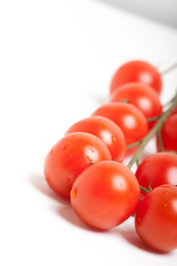 Bunch of Red Cherry Tomatoes on White Background