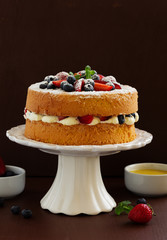 Genoise (cake) with cream, berries and lemon cream.