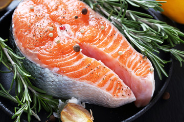 Salmon with rosemary in pan