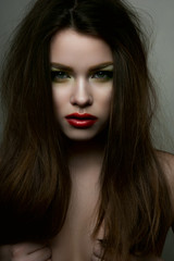 Fototapeta premium Beauty fashion model with red lips and hands on breasts