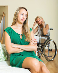 Tired woman and disabled person