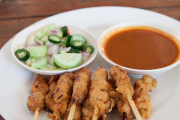 grilled pork satay with peanut sauce and vinegar