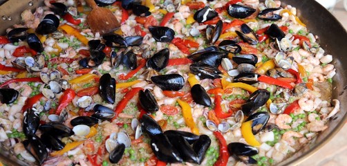 Fototapeta na wymiar Valencian Paella rice with clams and mussels