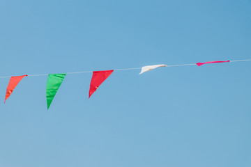 Moving Multi Colored Triangular Flags Hanging in the Sky
