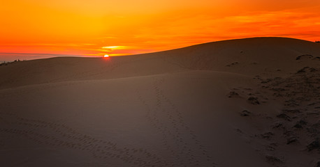 Fototapeta na wymiar Sunset in White Sand Dunes, Mui Ne, Vietnam