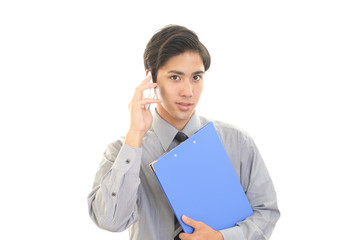 通話中の笑顔のビジネスマン