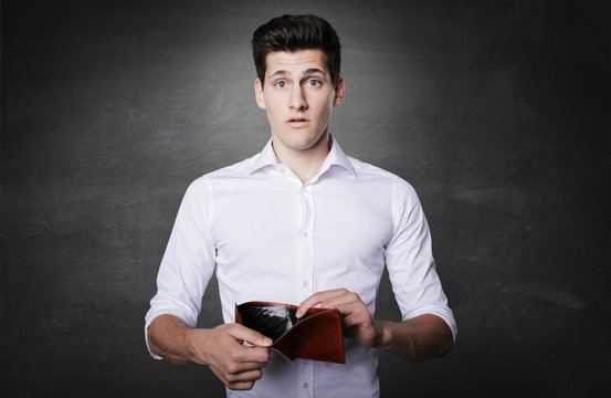 Attractive Brunette Young Business Man Holding Out Empty