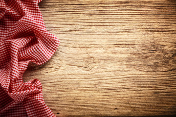 Checkered tablecloth on wooden table