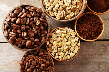 Various of coffee in small dishes on wooden table, top view