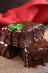 Delicious chocolate cakes on table close-up