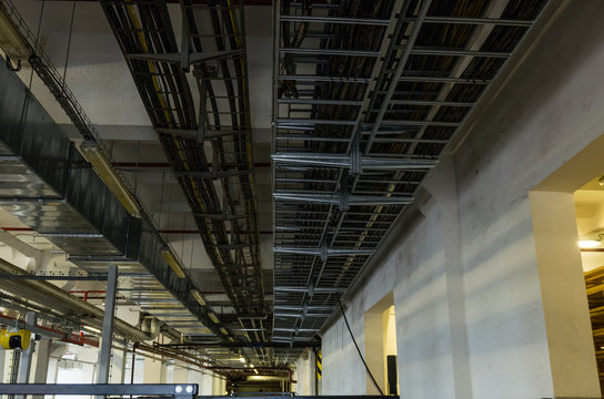 Cable trays and pipes in industrial building