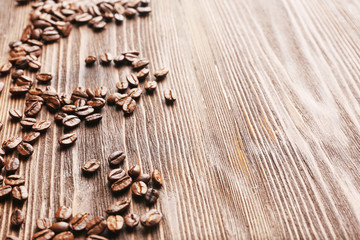 Coffee beans on wooden background