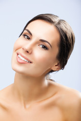 Fototapeta premium Portrait of beautiful smiling woman, on grey