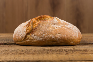 white bread over wooden background