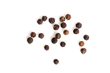 Black pepper seeds on white