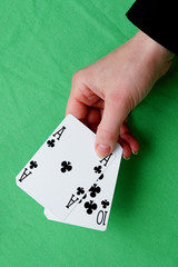 hand holding best classic blackjack combination ten and ace of c