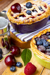 Decorated homemade shortcrust pastry berry pies