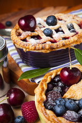 Decorated homemade shortcrust pastry berry pies