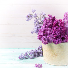 Background with  lilac flowers in bowl
