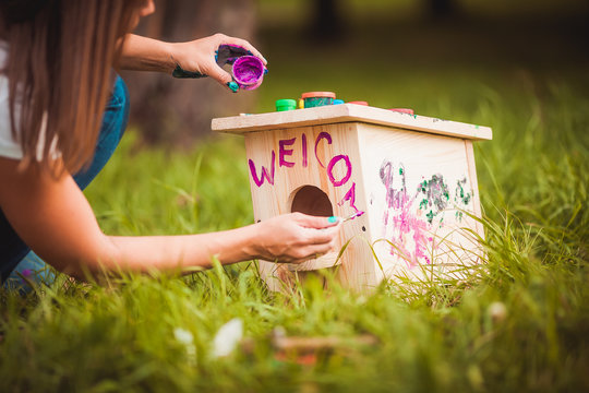 Girl Painting Birdhouse