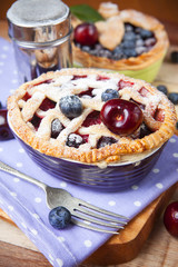 Decorated homemade shortcrust pastry berry pies