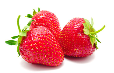 Three perfect red ripe strawberry isolated