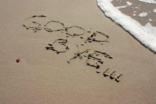 Words Good bye written on the beach at summer