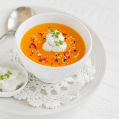 pumpkin soup with paprika, flax seeds and cream 