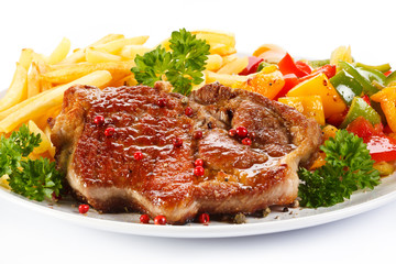 Grilled steak, French fries and vegetables 