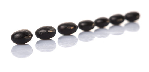Black beans over white background