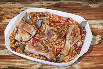 Pan of Chicken Meat and Vegetable Stew on old Wooden Table.