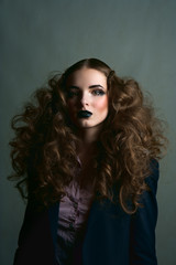 Curly brunette girl with black lips